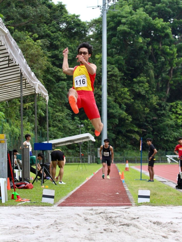Abel mid-air during a long jump